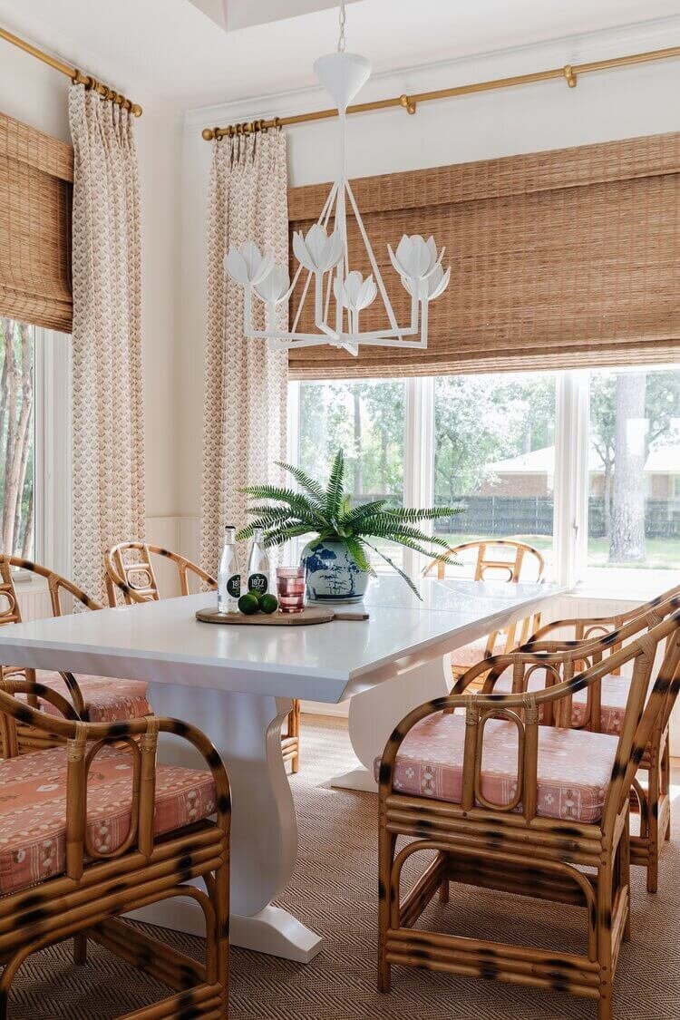oyster creek studios home on the range wooden chairs around white dining room table with natural shades and white chandelier