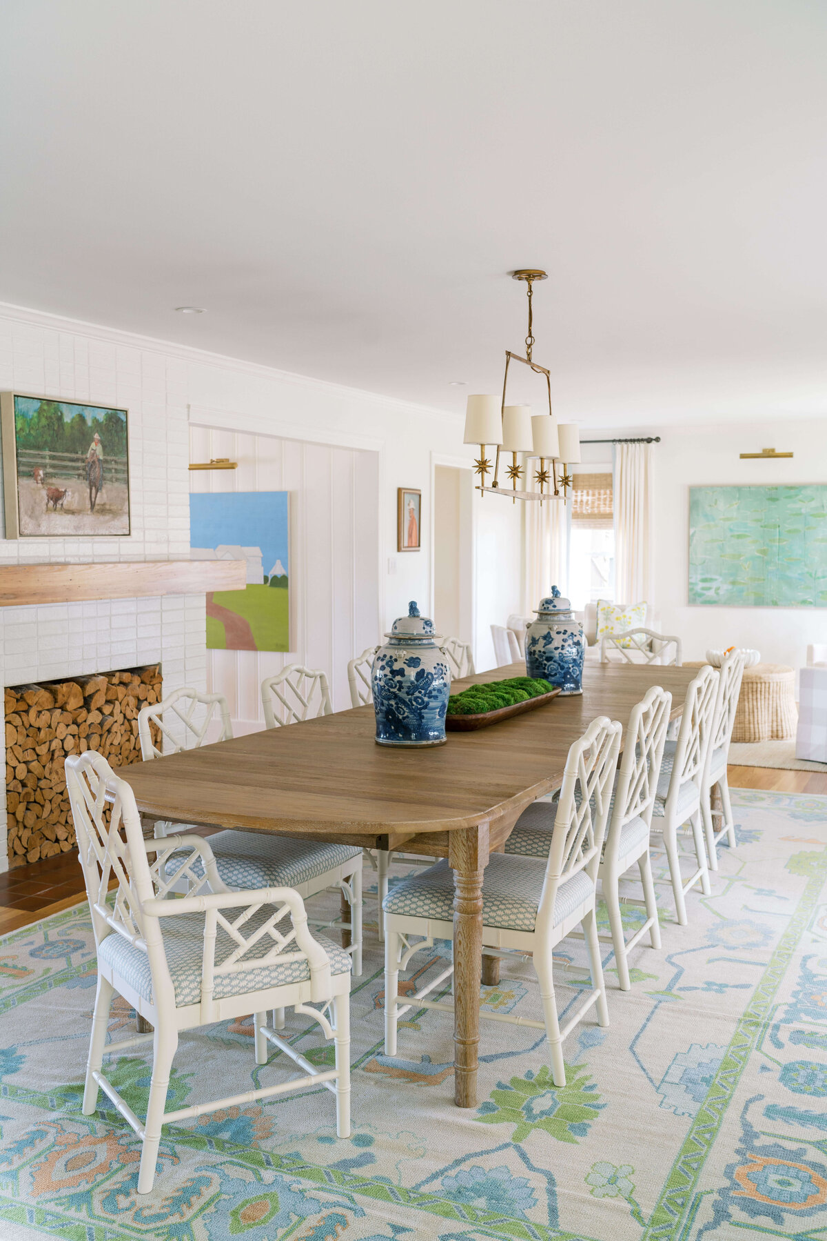 oyster creek studios happy valley white chairs around a wooden dining room table with white and green patterned rug