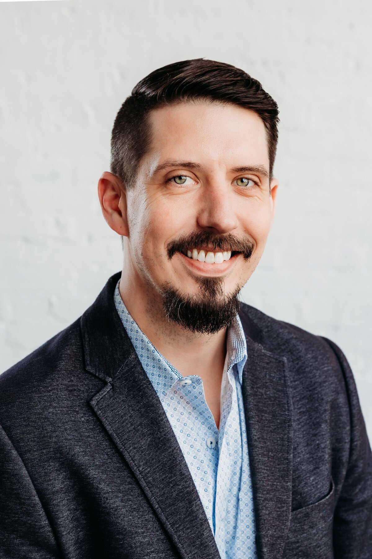 Portrait of a male business person posing for headshot.