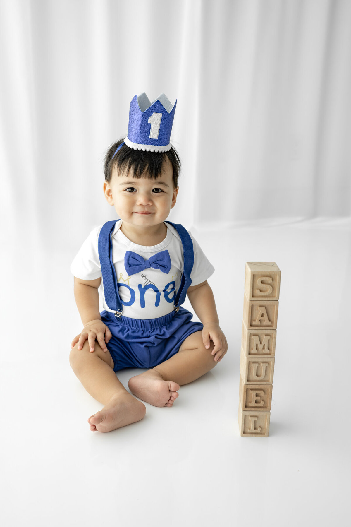 Boy in birthday outfit during themed cake smash session— captured by Alliston and Barrie cake smash photographer.
