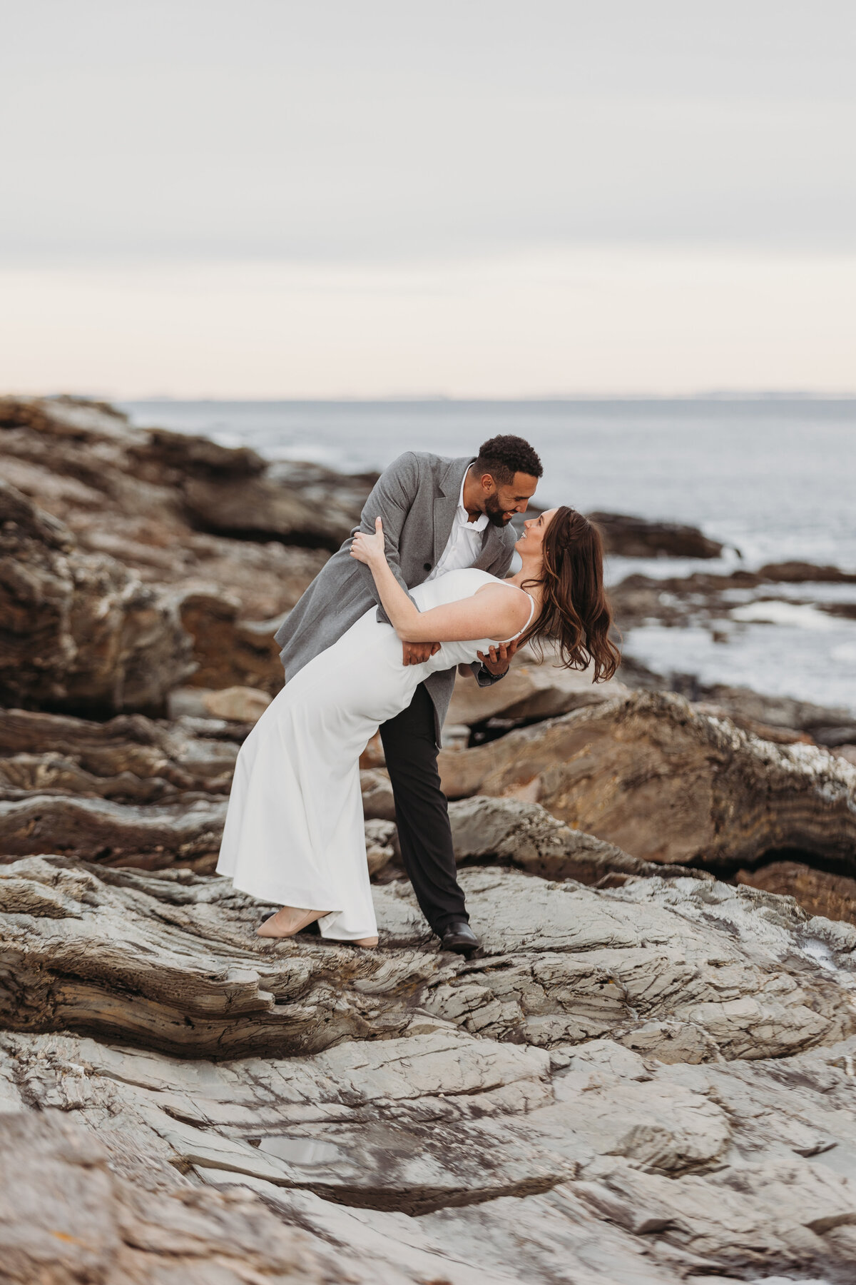 bride and groom  embracing on beach
