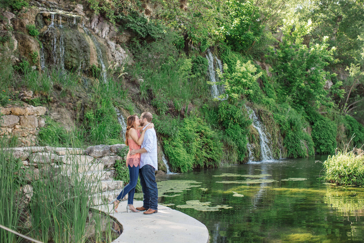 engagement session in Spring Branch Texas at Remi's Ridge Hidden Falls by Texas wedding photographer with waterfall and sunrise