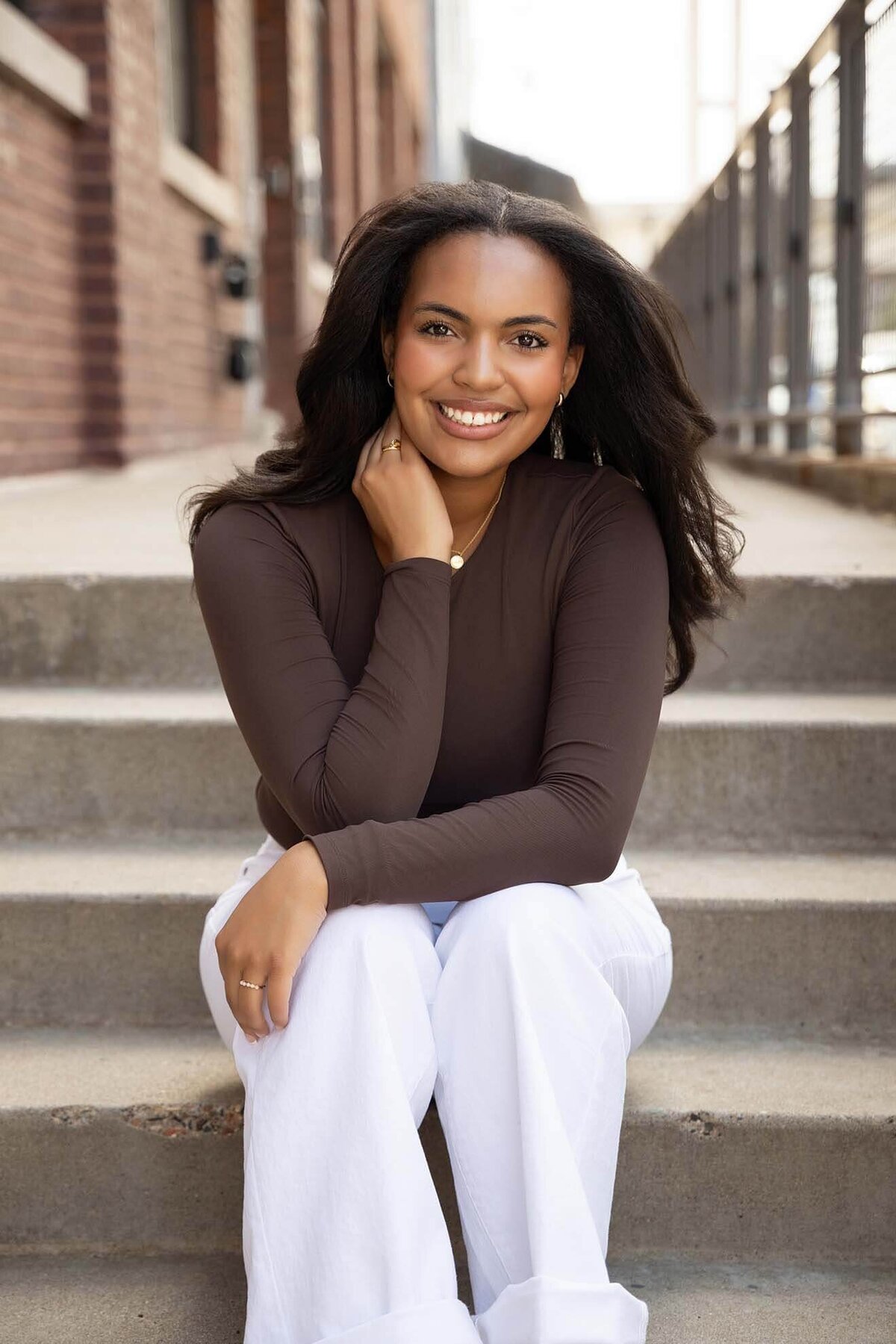 senior-girl-posed-on-city-steps