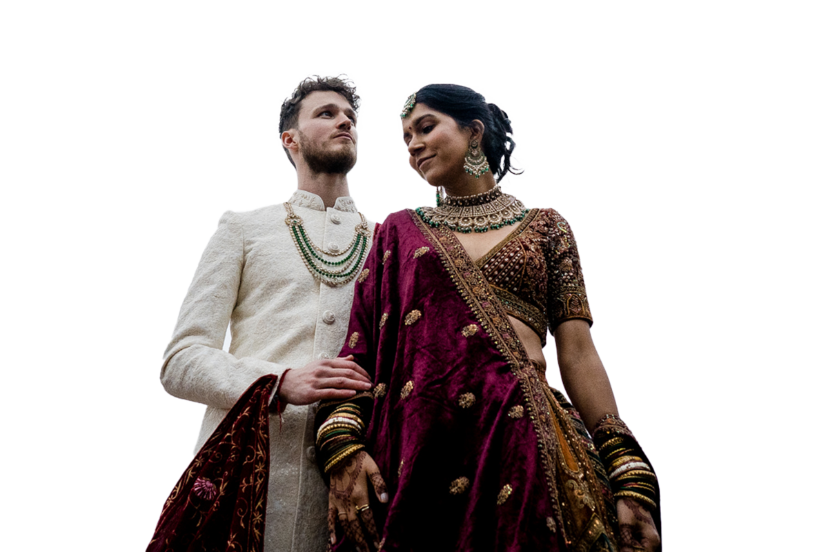 cut out photograph of a hindu wedding couple, the groom is touching the brides arm.