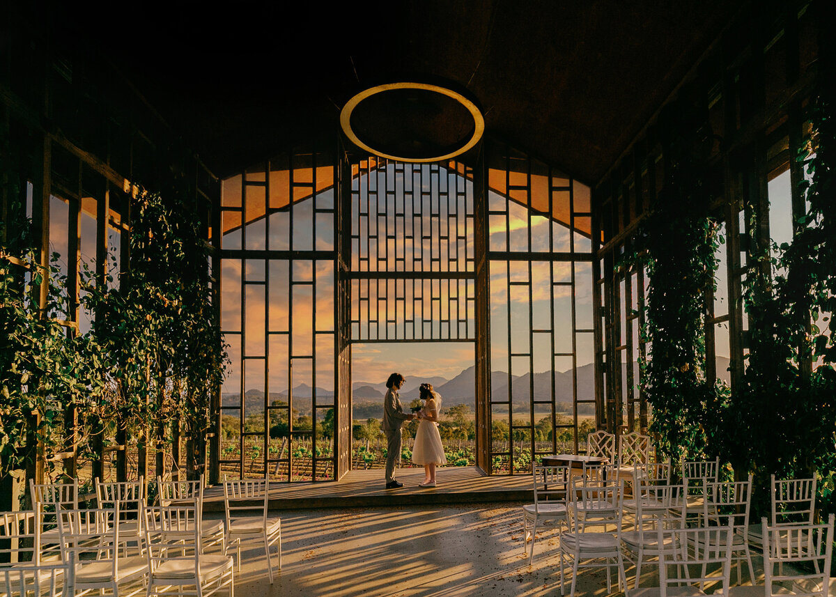 Couple exchanging vows at sunset inside the chapel at Kooroomba Lavender Farm — inclusive Brisbane wedding photography celebrating all love.