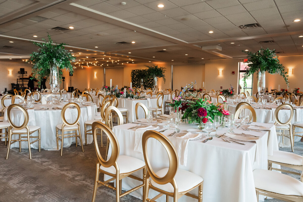 wedding reception setup in the ballroom at The Lake Club Ohio with centerpices designed by Lou Lou Blooms
