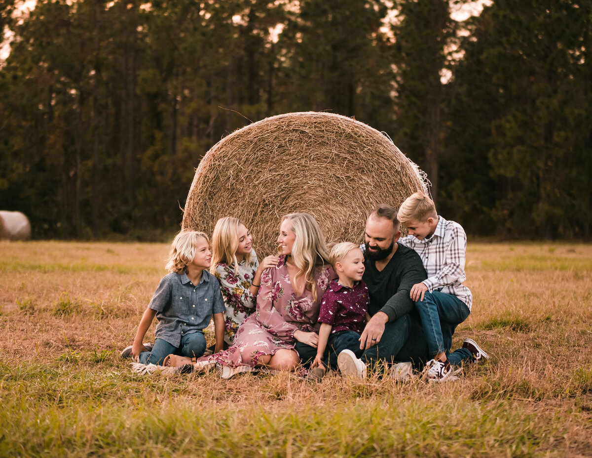 rustic autumn family photos  in field by orlando family photographer
