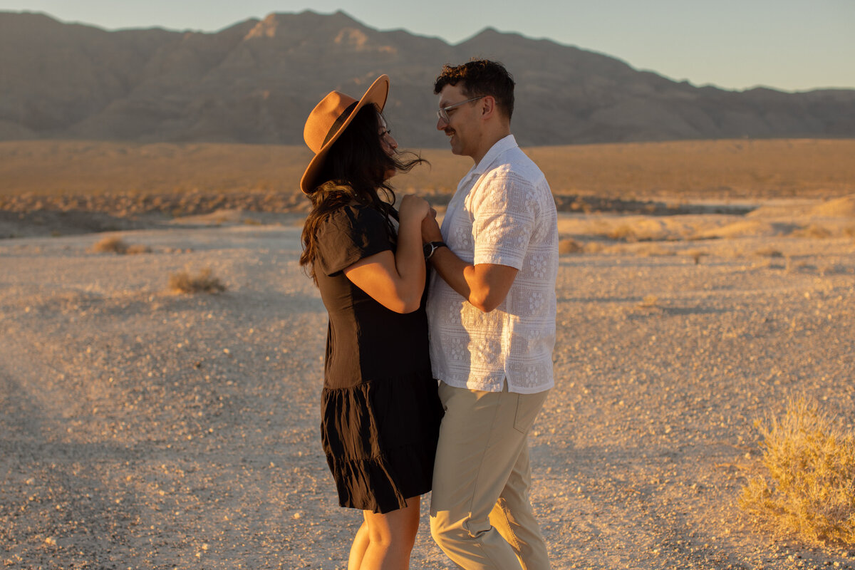 couple dancing for their anniversary session in las vegas desert with alexis dean photography
