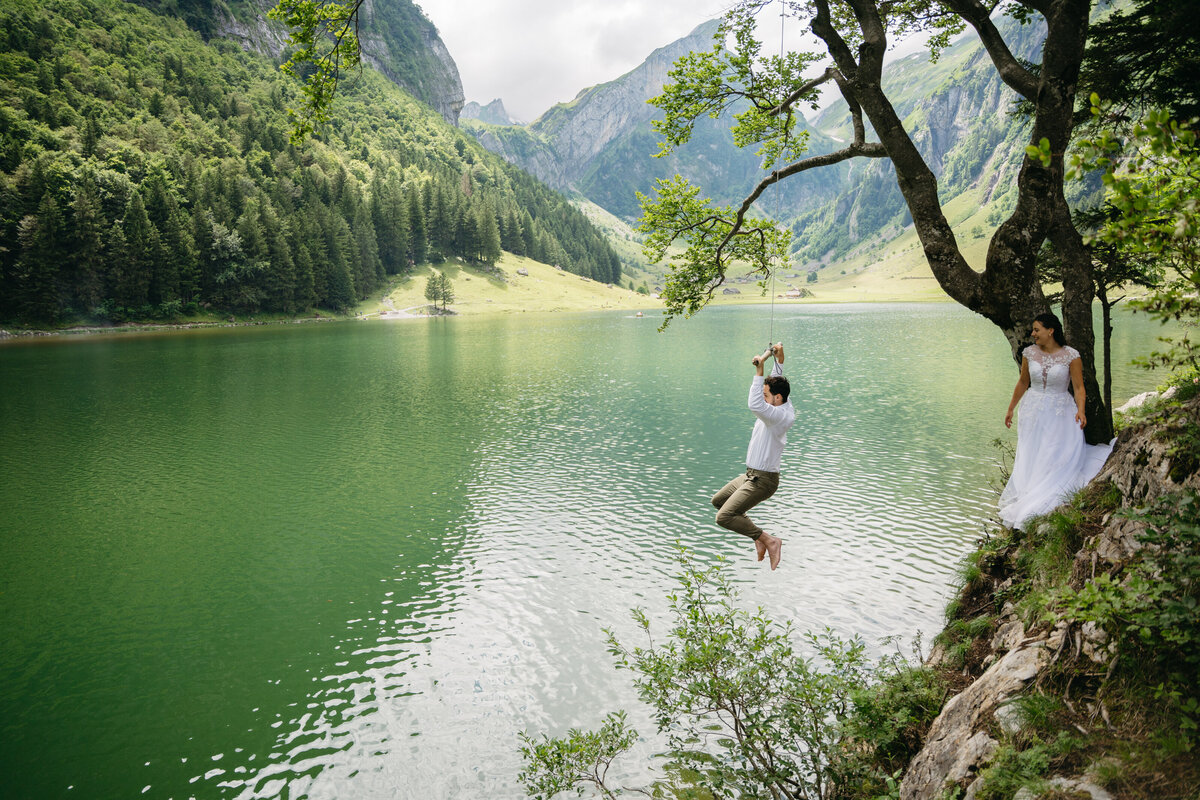 Groom using rope swing at Seealpsee