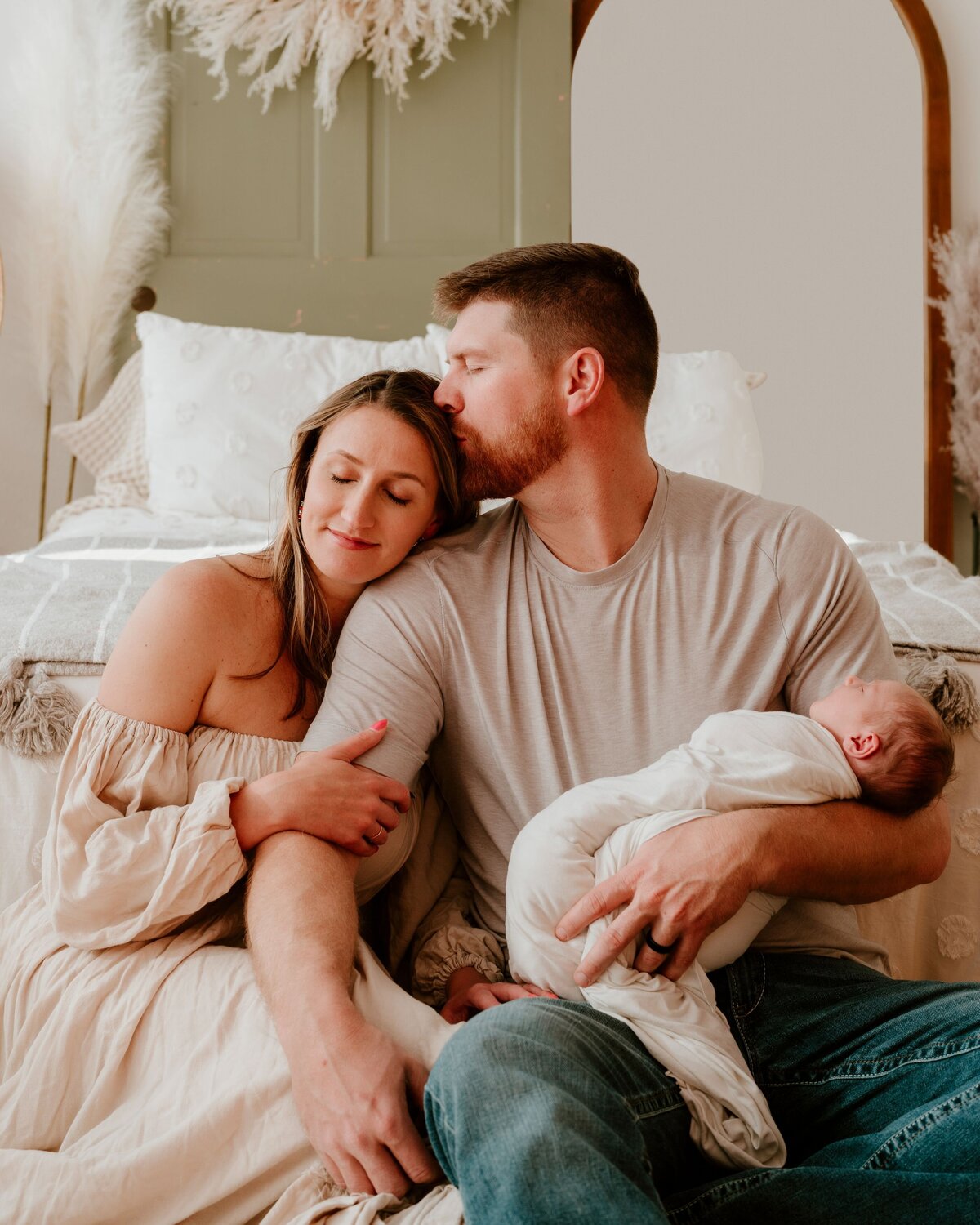 denver family photographer - husband kissing wife's head