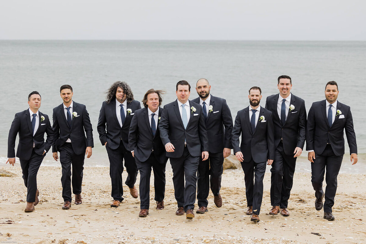 Groom with groomsmen on the beach at Long Island wedding