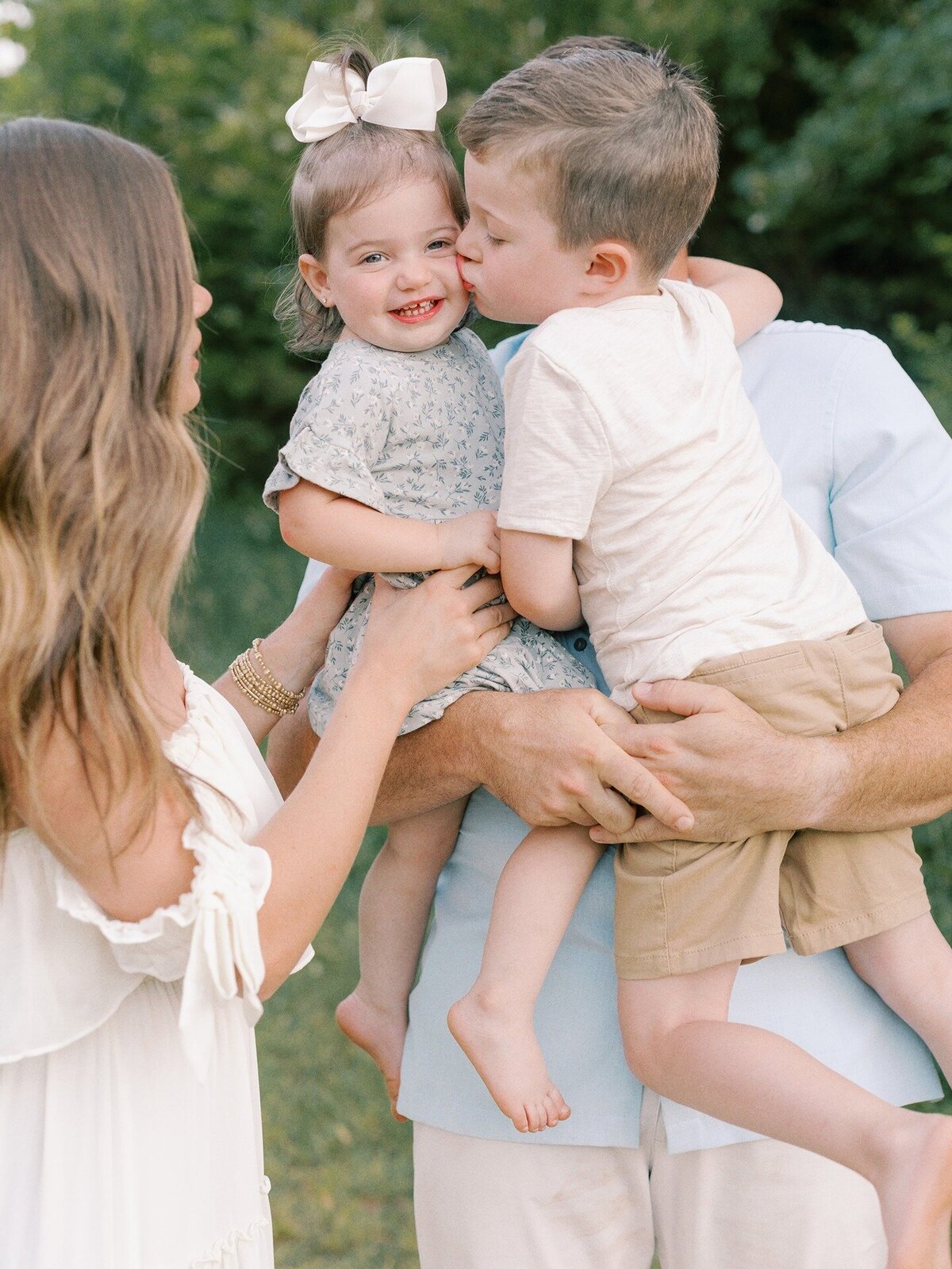 brother-kissing-sister-on-cheek