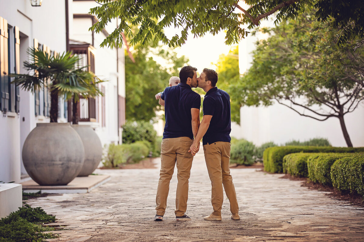 gay men with their new baby at Alys Beach