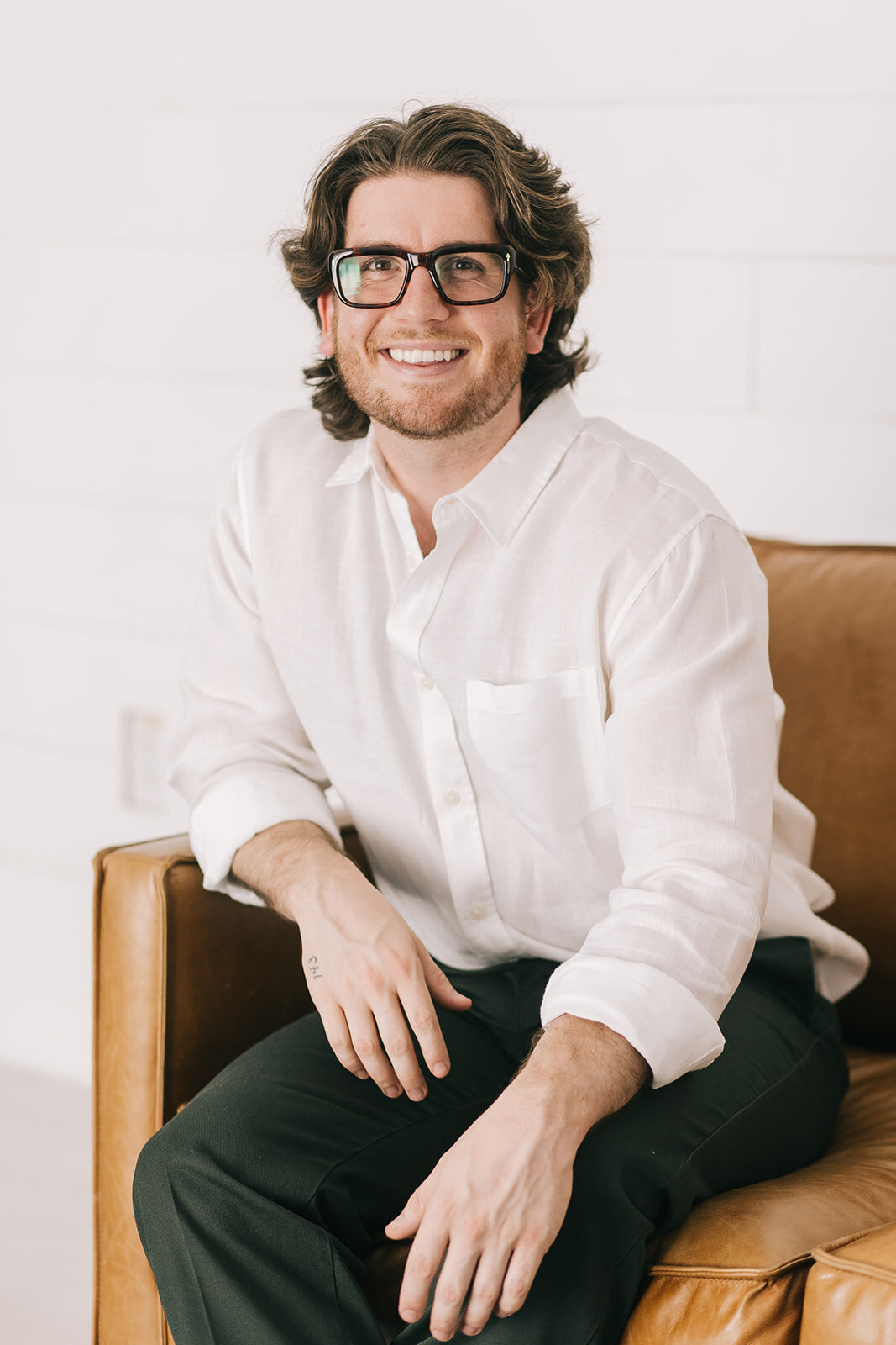 Professional headshot of Fort Worth marketing consultant smiling.