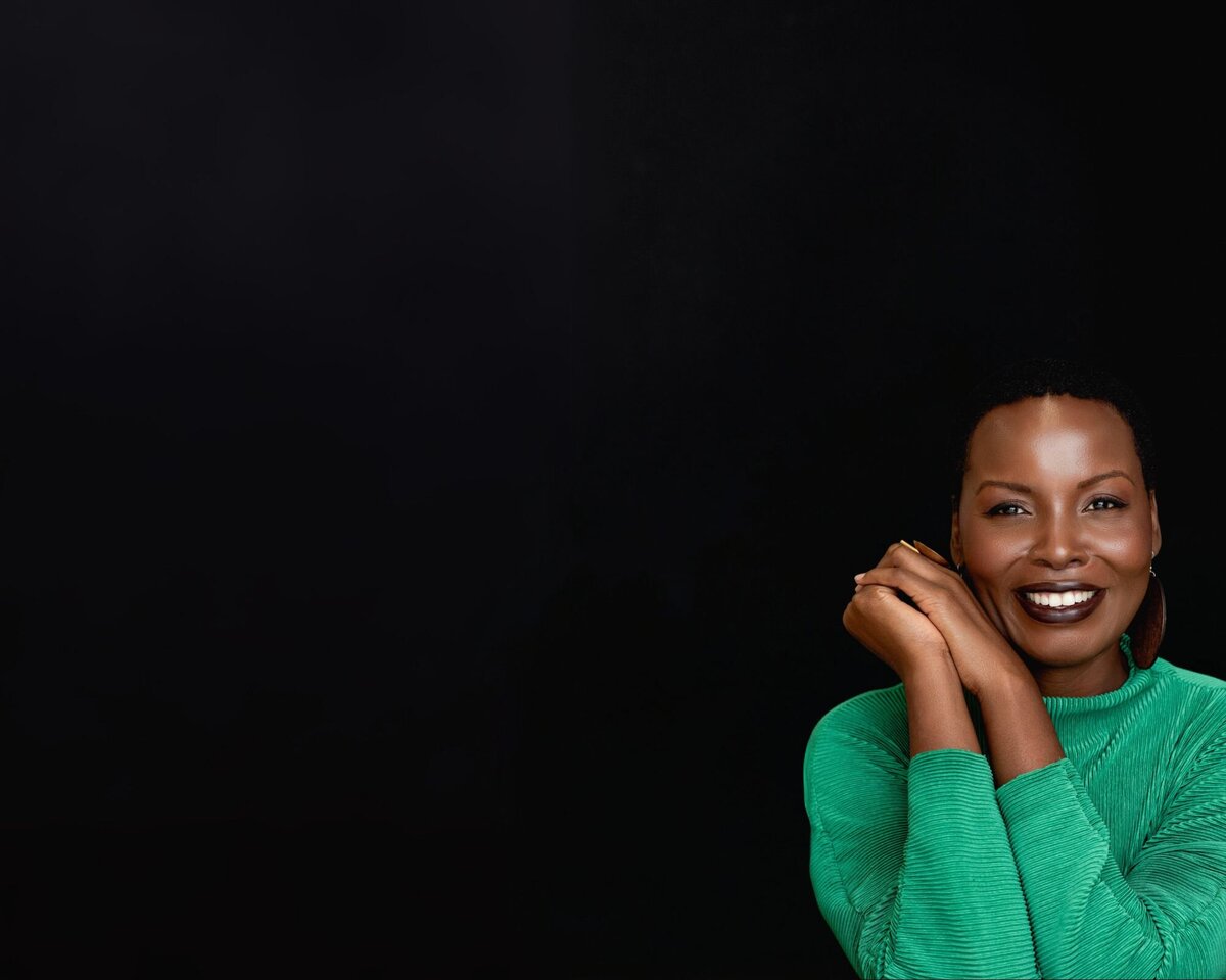 headshot of Marjorie Richard smiling with neutral background