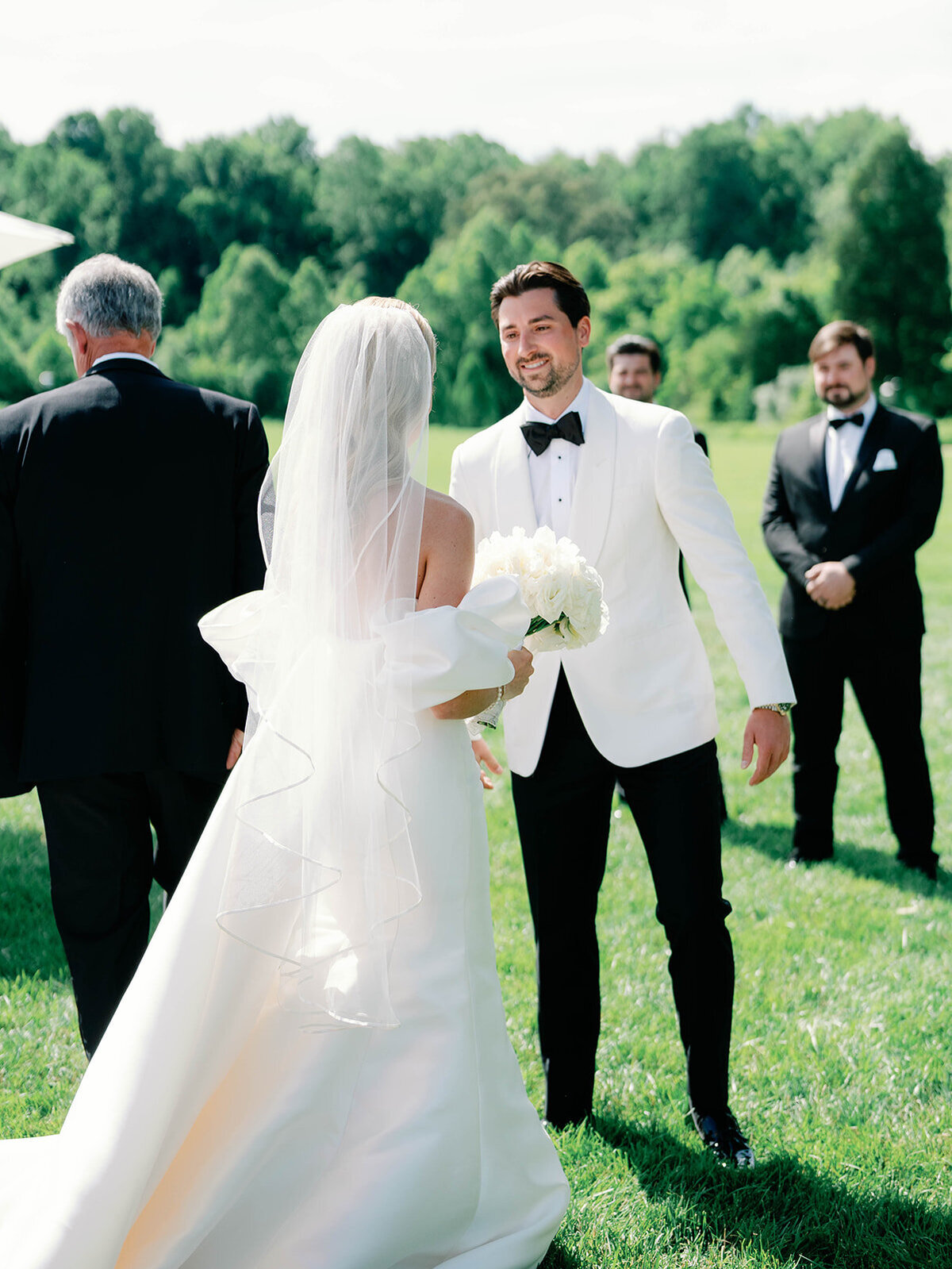 Bride and groom see eachother at the aisle