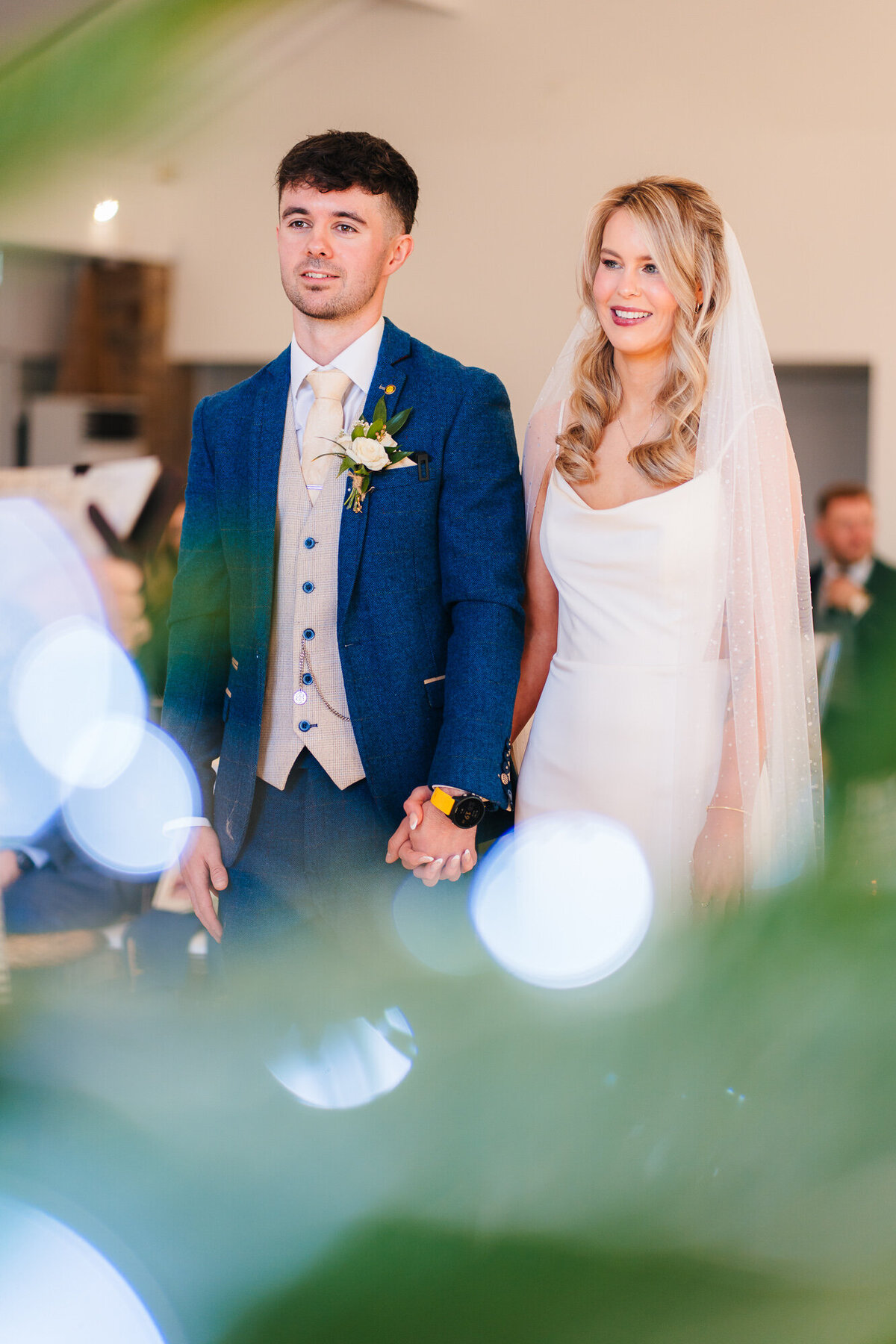 Bride and groom smiling during theor wedding ceremony at Mytton Fold Hotel Taken by candid wedding photographer Anthony Horseman
