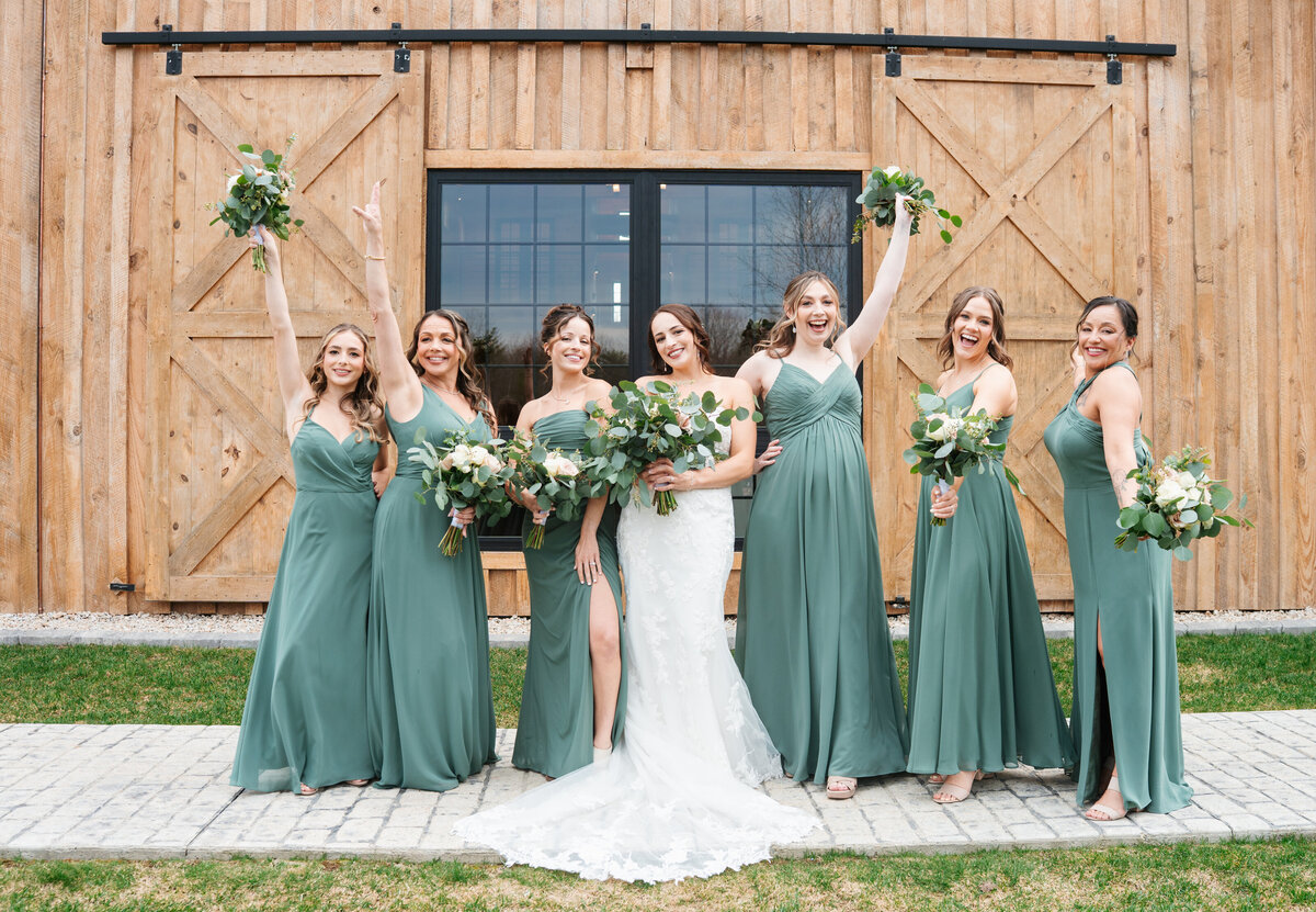 Bride and groom laughing together during wedding day portraits