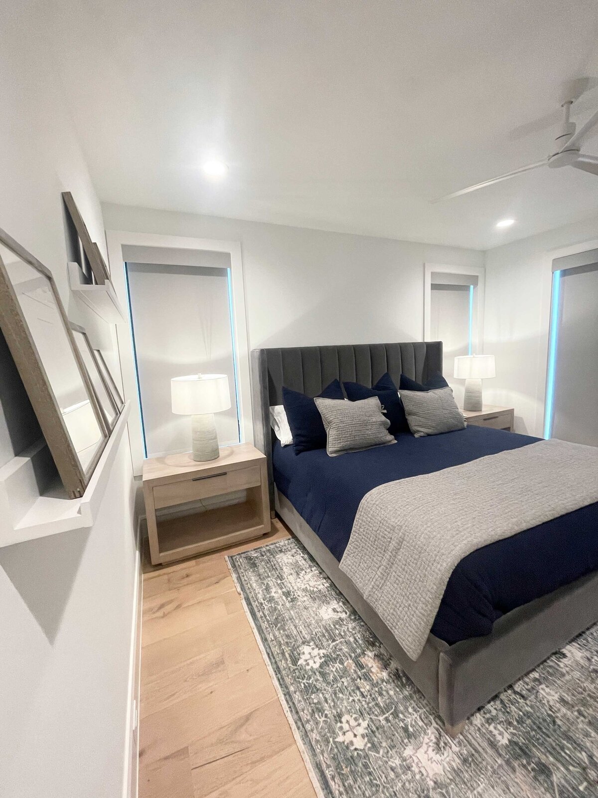 Home remodeling and design bedroom featuring an elegant atmosphere with dark colors, sophisticated furniture, and stylish accessories curated by an expert interior designer to create a luxurious space.