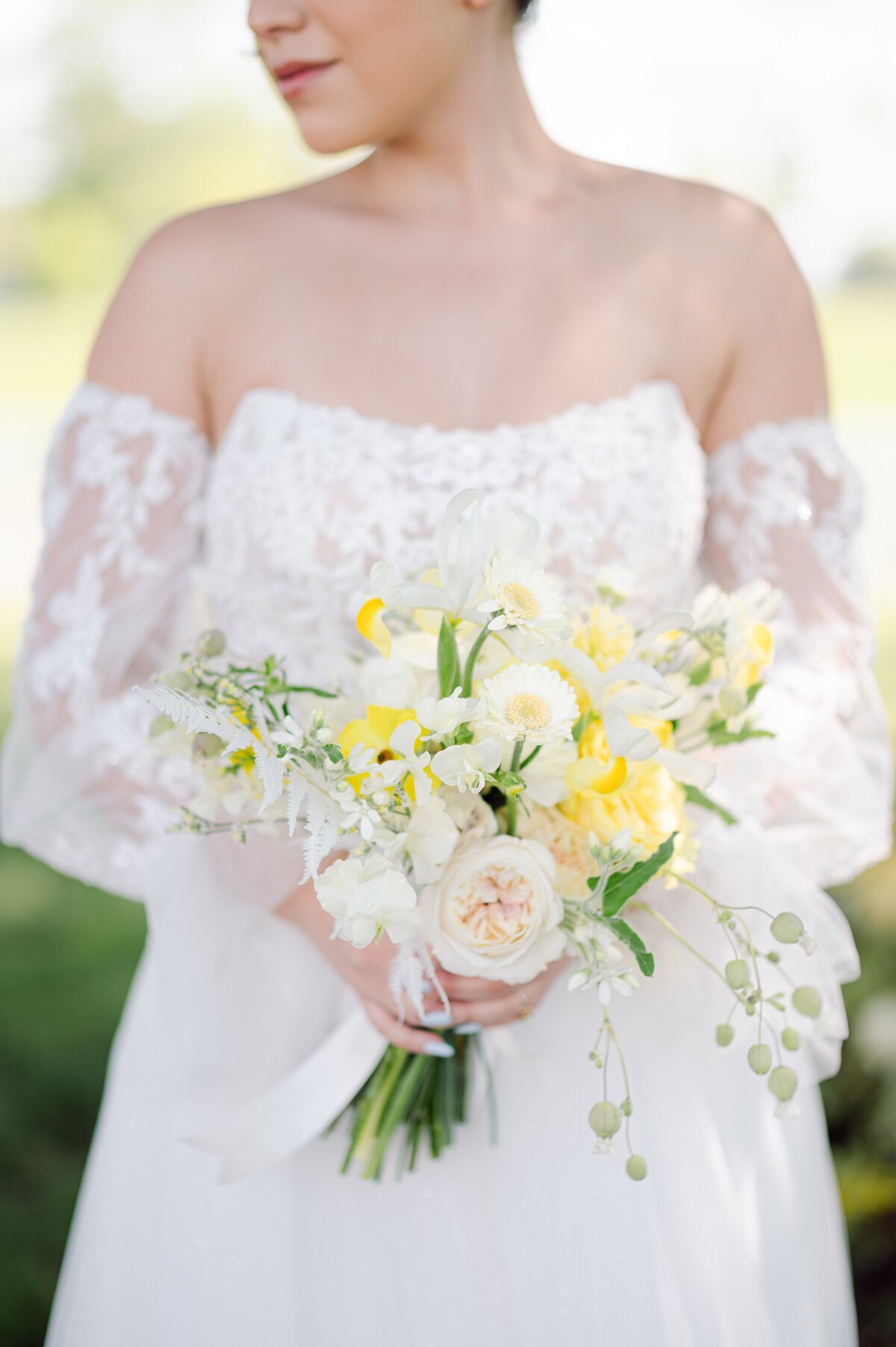 Bridal bouquet of white and yellow flowers