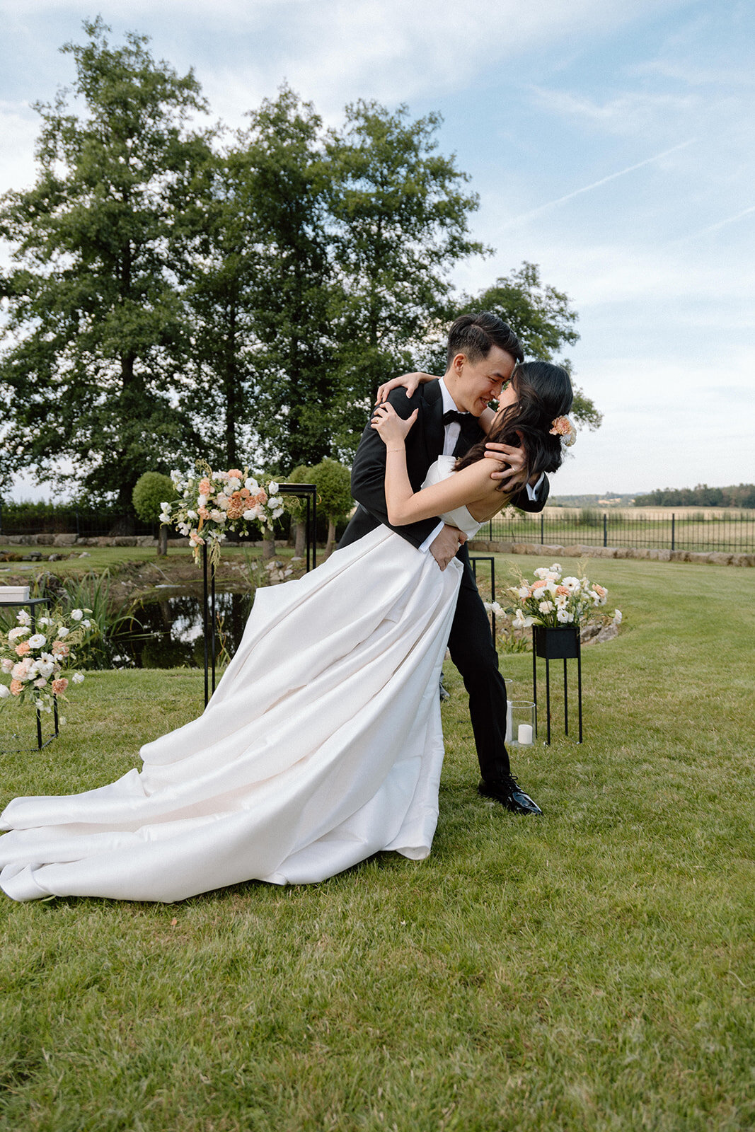 Luxury wedding in Europe – sophisticated bride in a modern wedding gown and groom in a timeless suit.