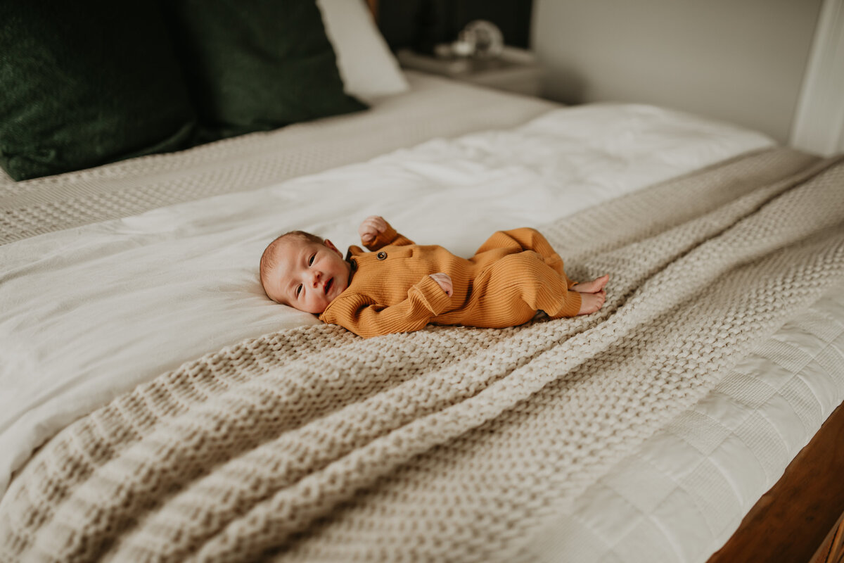Newborn baby photographed by premiere in-home newborn photographer, Cameron Fox of Foxc Photography, in Burleson, Texas.