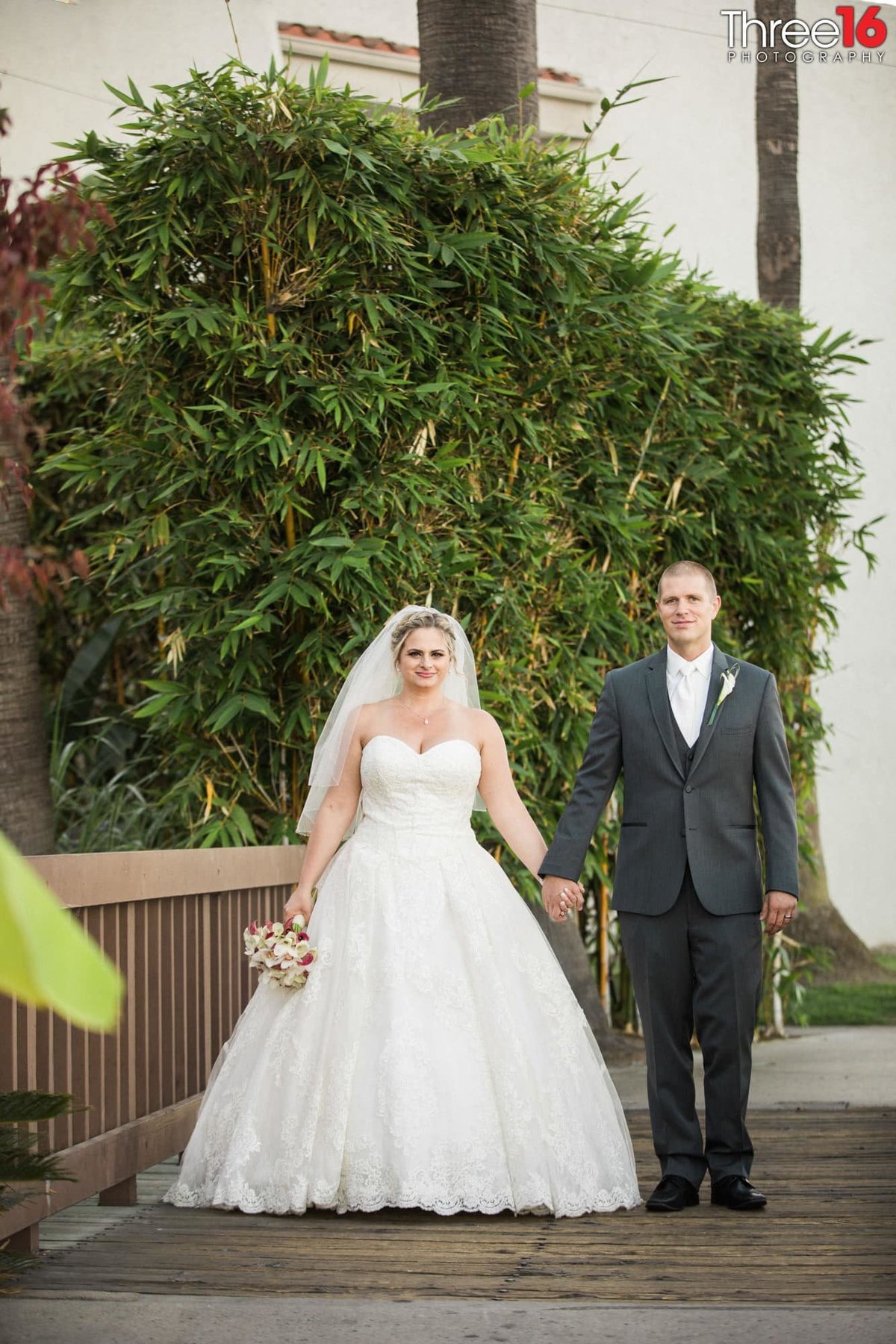 Newly married couple pose for the camera