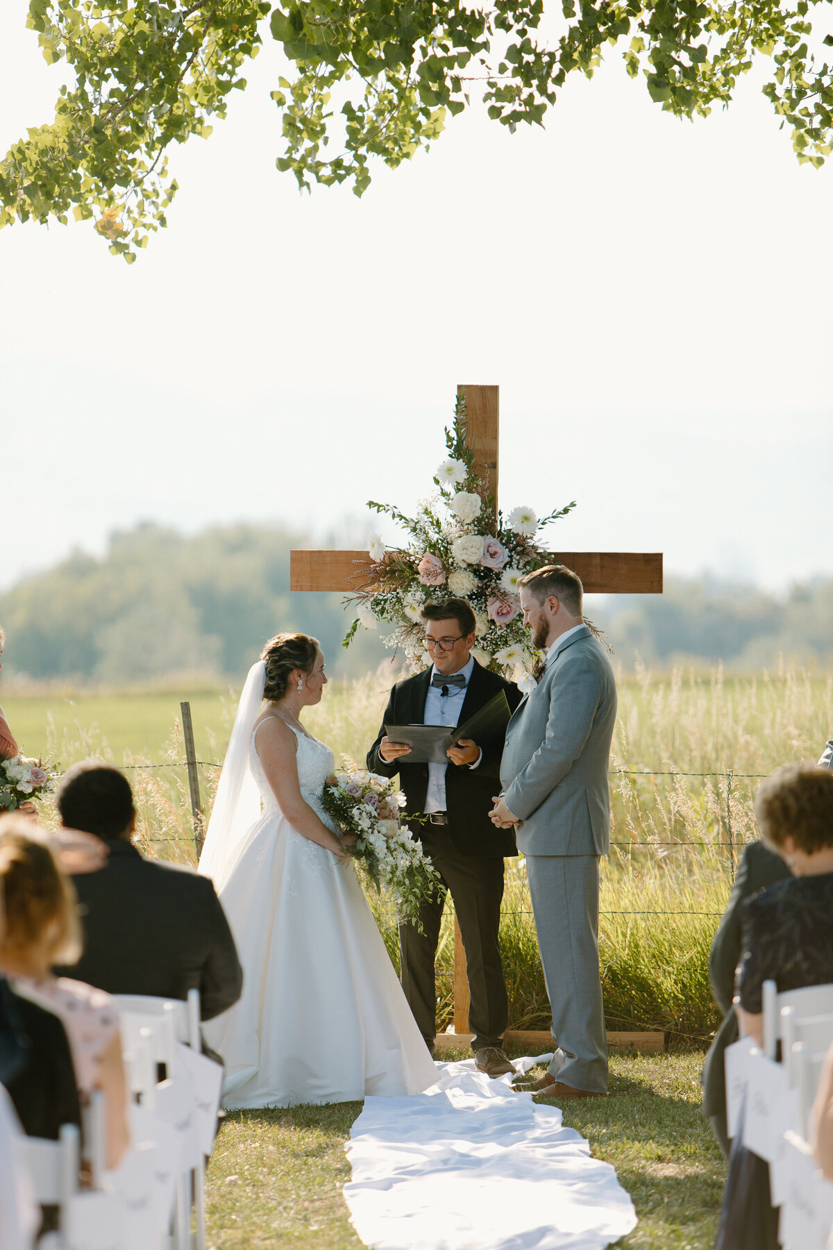 A couple stands at the altar during their Colorado Wedding.