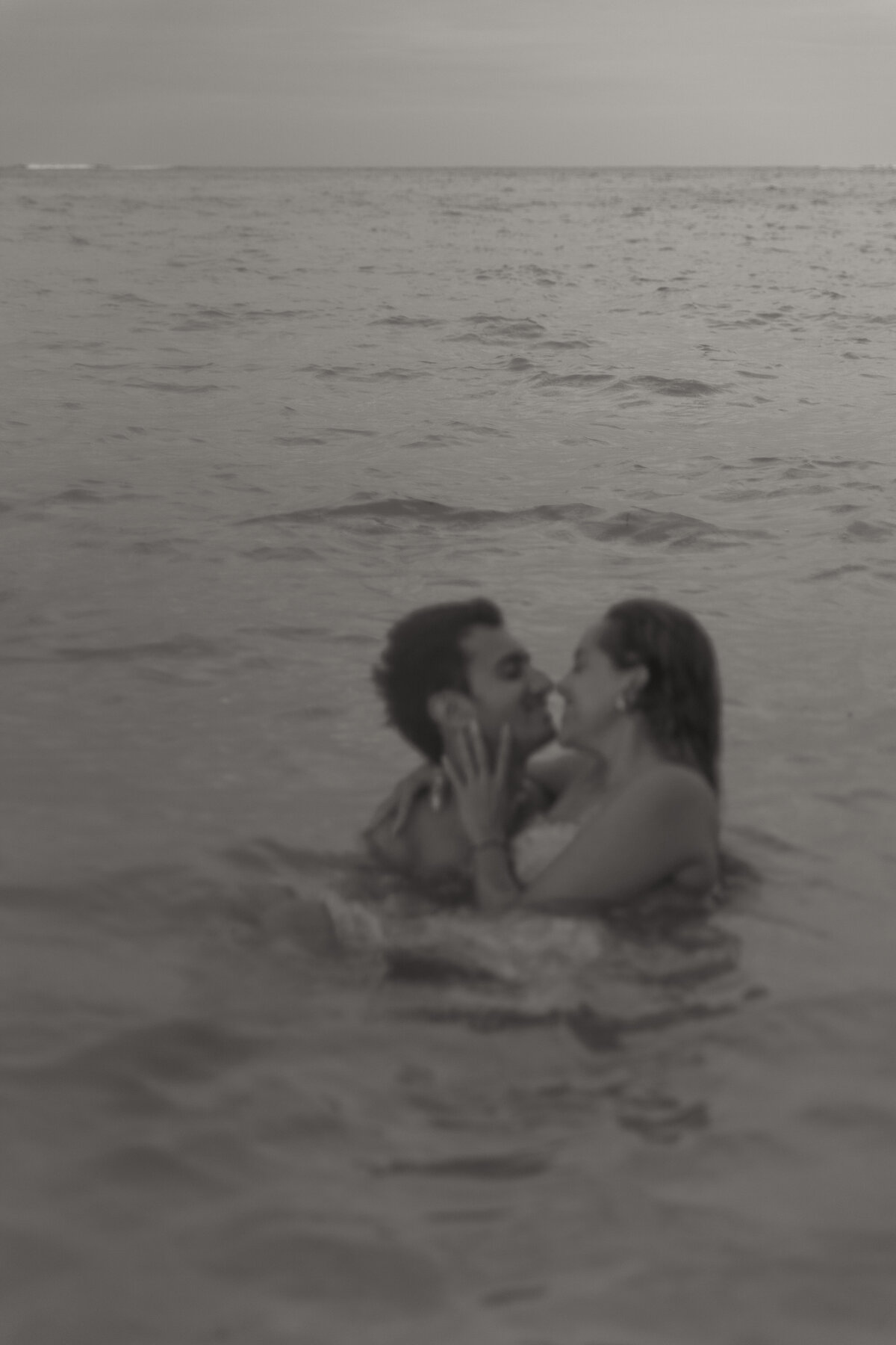 Black and White Photo of Destination Couple Photos on the Beach in the Water