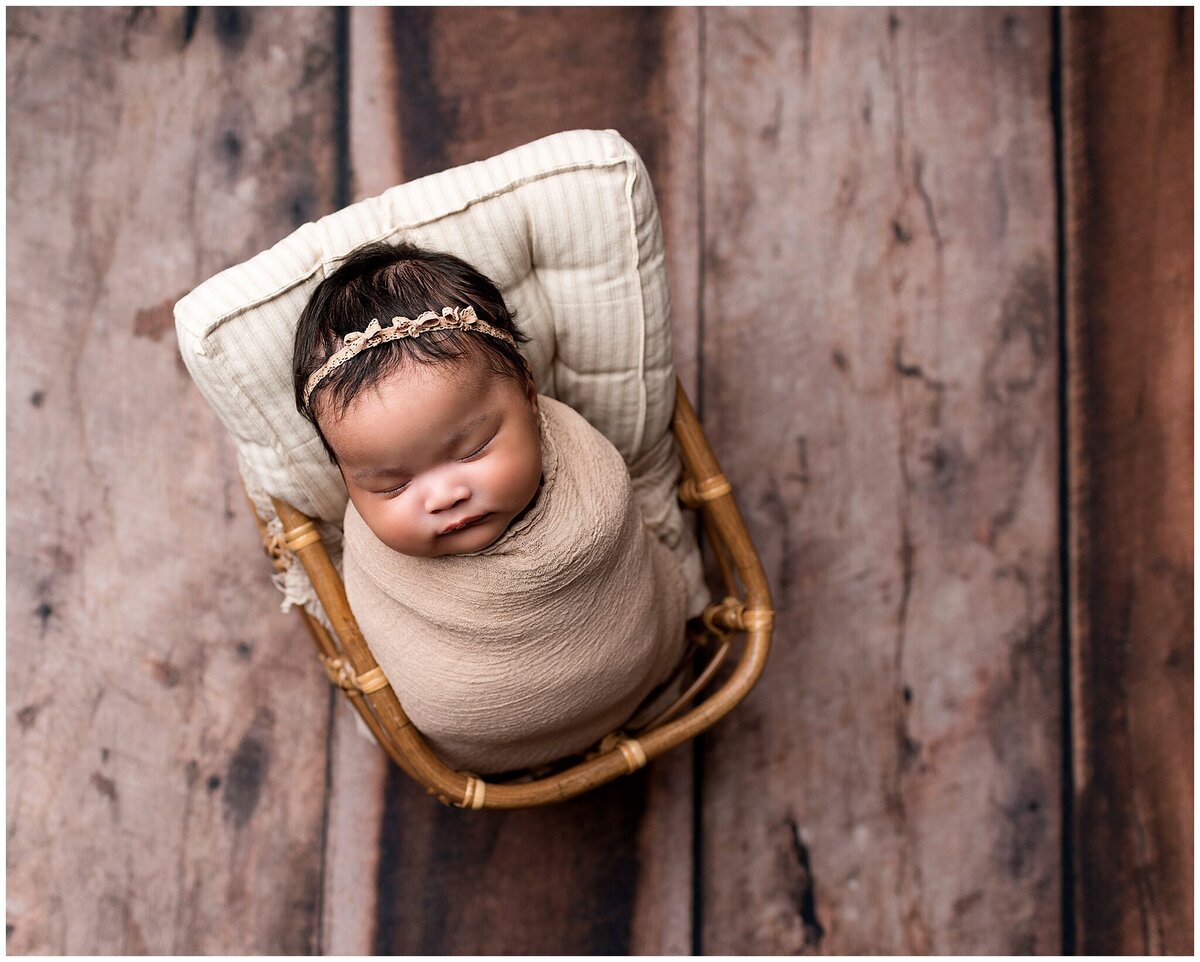 fully wrapped baby in basket