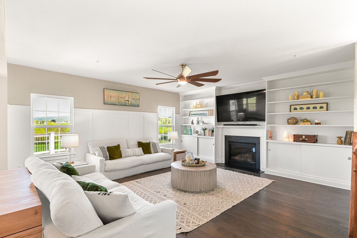 Living room with green and leather accents