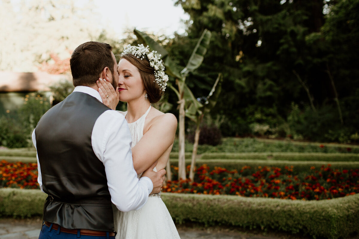 A bride and groom embrace in a sweet moment captured by Fort Worth Wedding Photographer, Megan Christine Studio