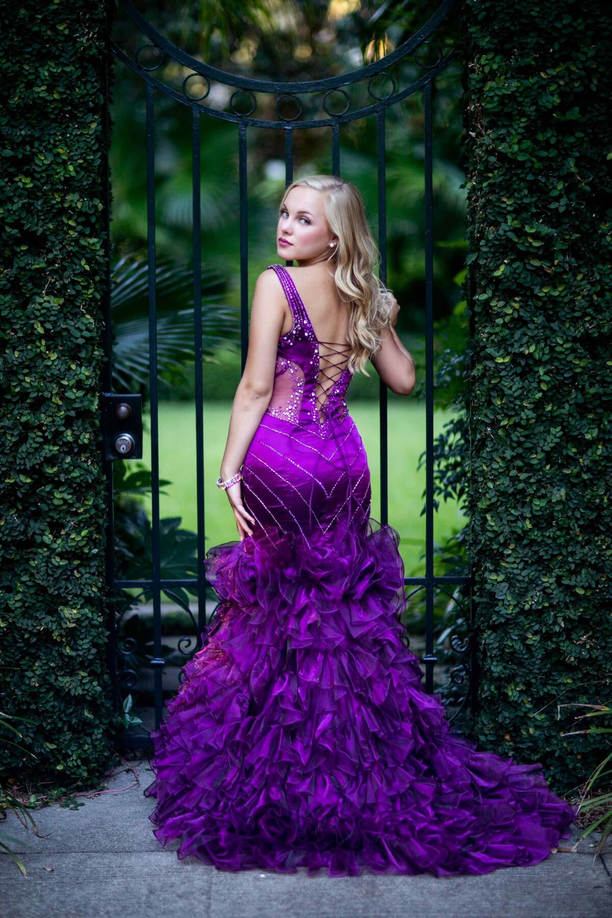 senior portrait back to camera purple gown