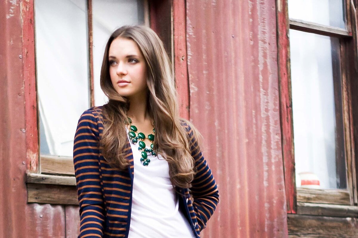 Senior girl posing in front of abandoned building in Lehi, Utah.