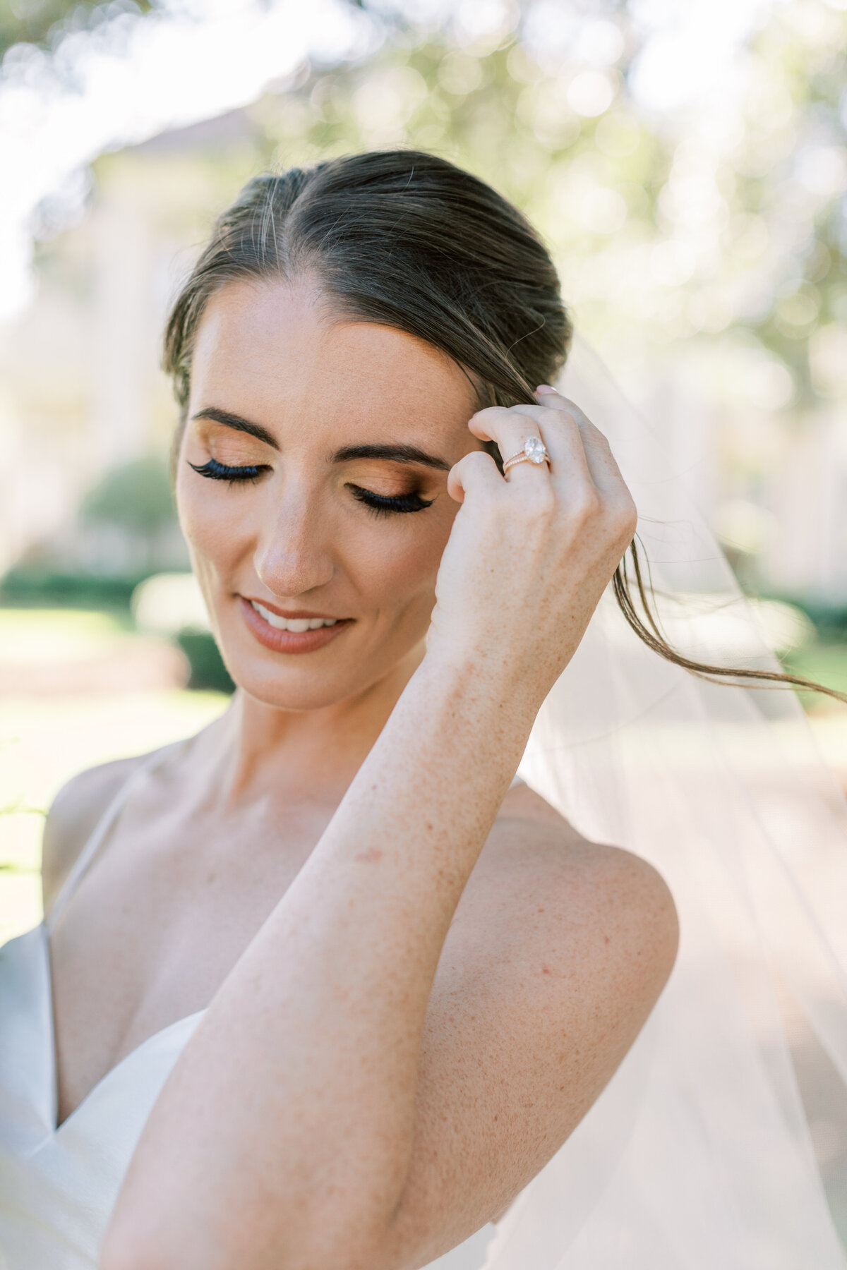 A bride fixes her hair.