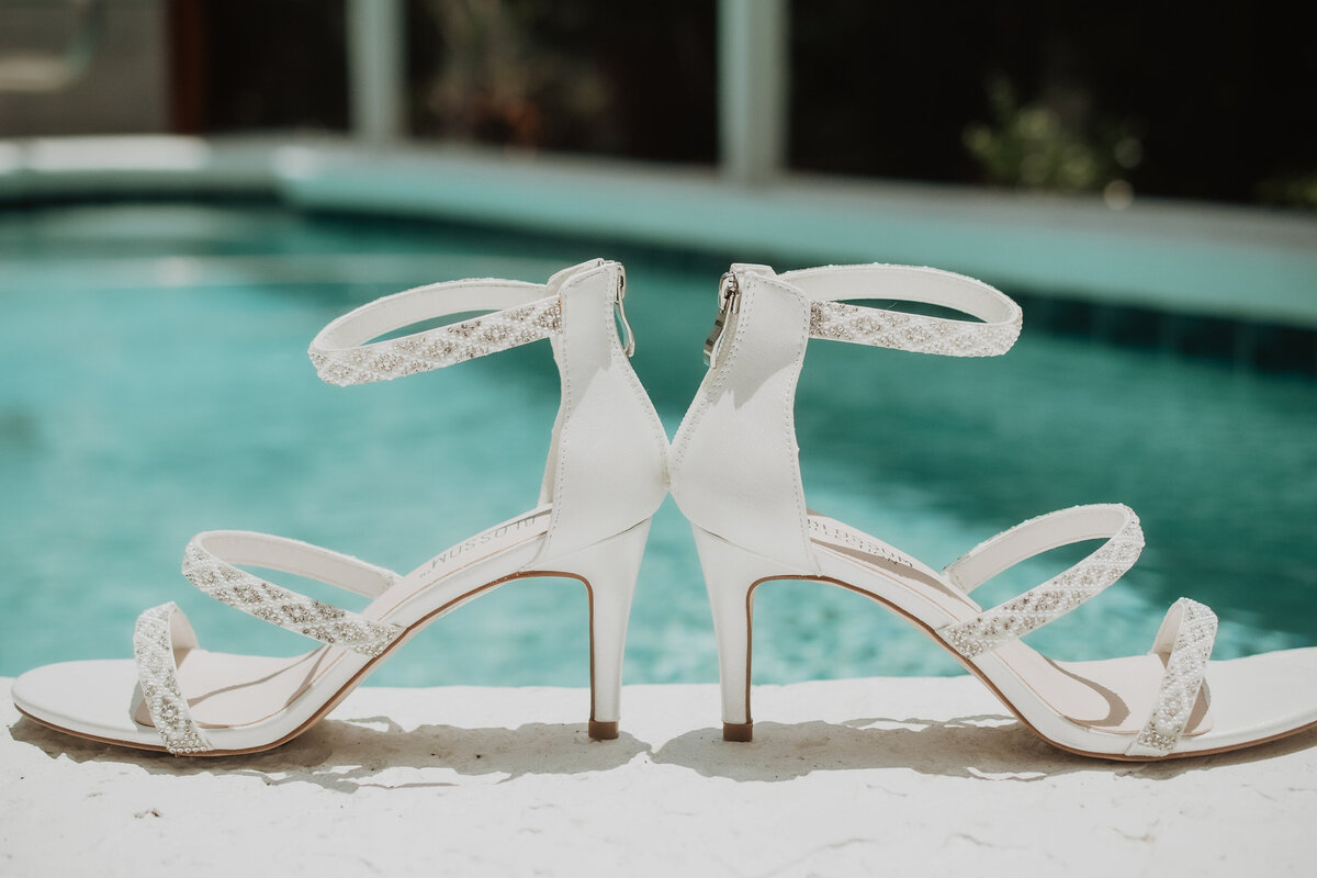 wedding shoes by the pool