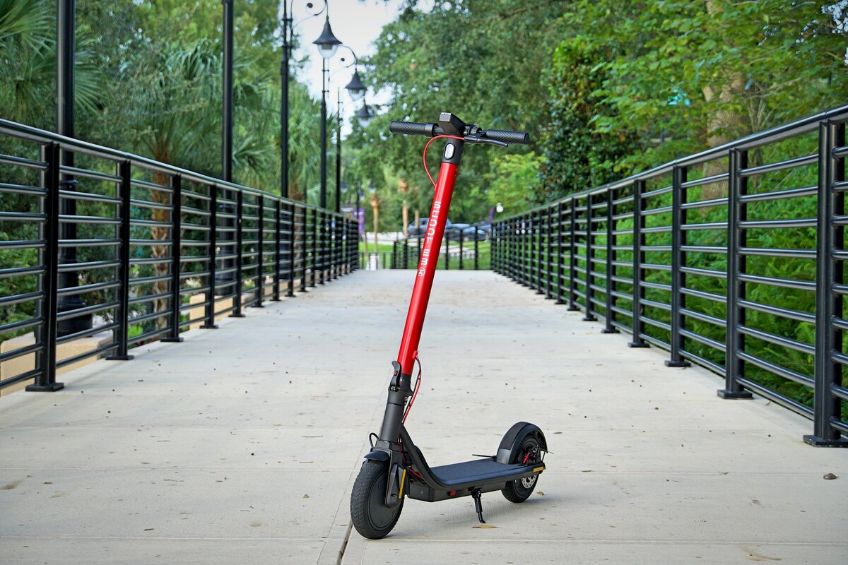 Scoot E-3 on red concrete; V&D Electric Bikes