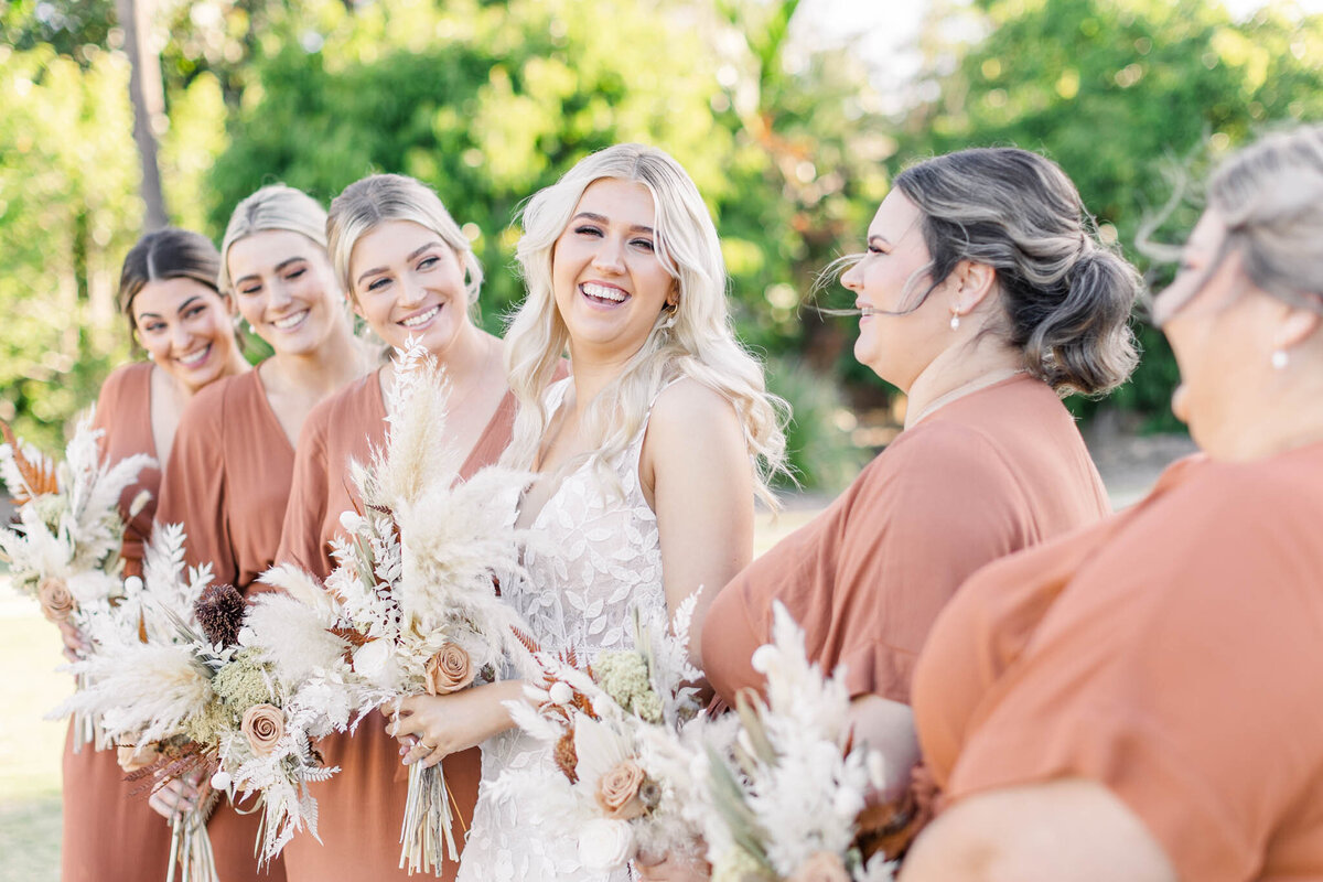 bride laughs with her bridal party at freedom shores resort