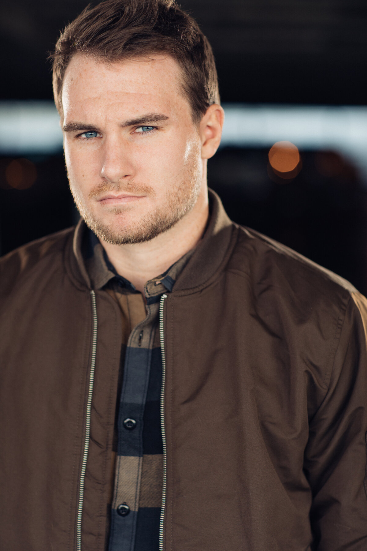 Man Wearing Brown Outer Jacket and Inner Checkered Headshot in LA