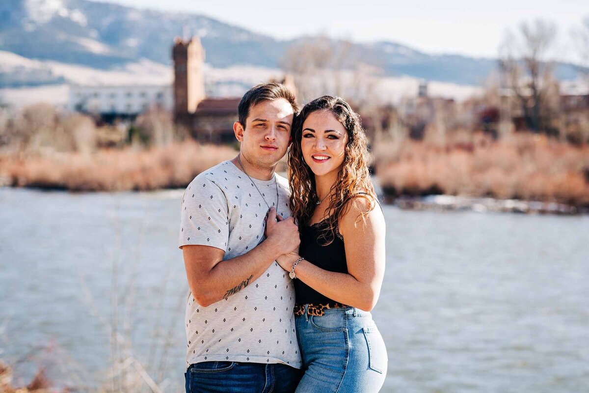 Engagement photo of Missoula couple at Caras Park, downtown Missoula