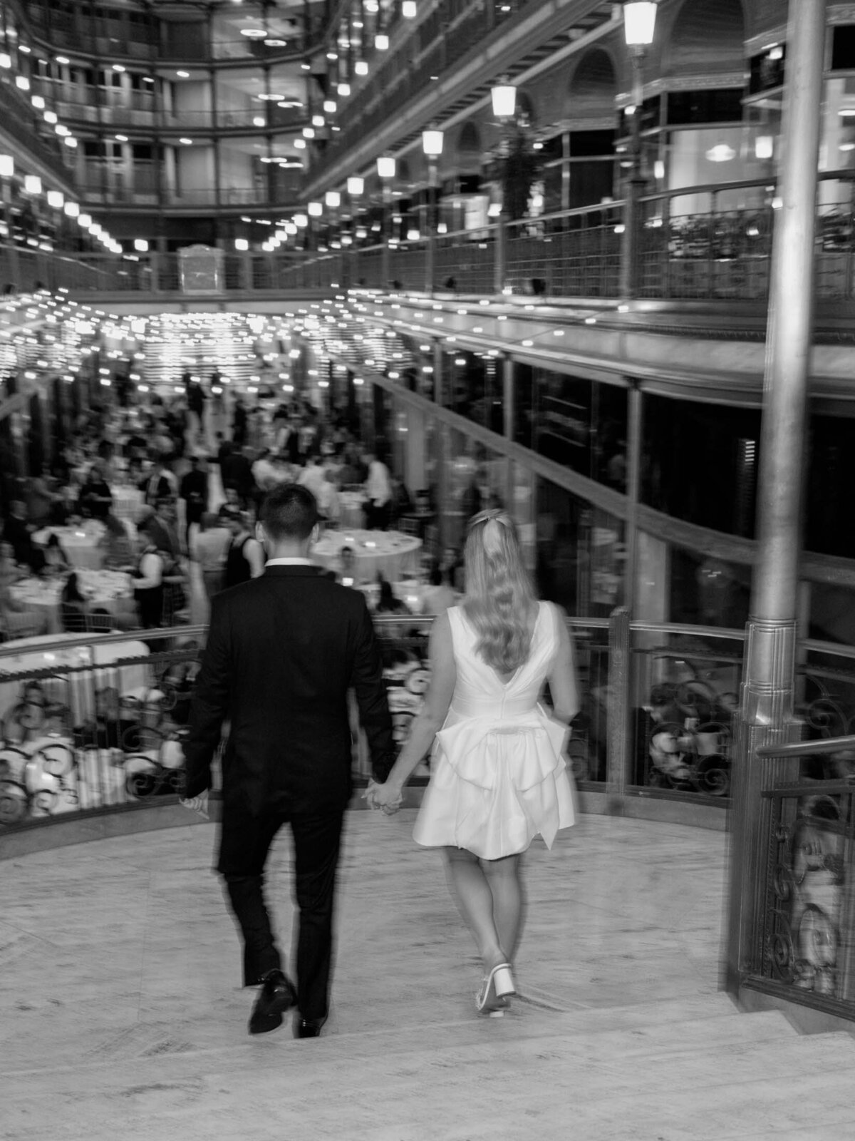 Couple sharing a quiet moment under string lights at The Arcade Cleveland