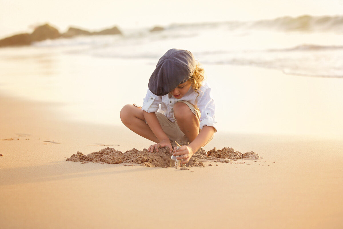 Boy playing in the sand_Victoria Photographer