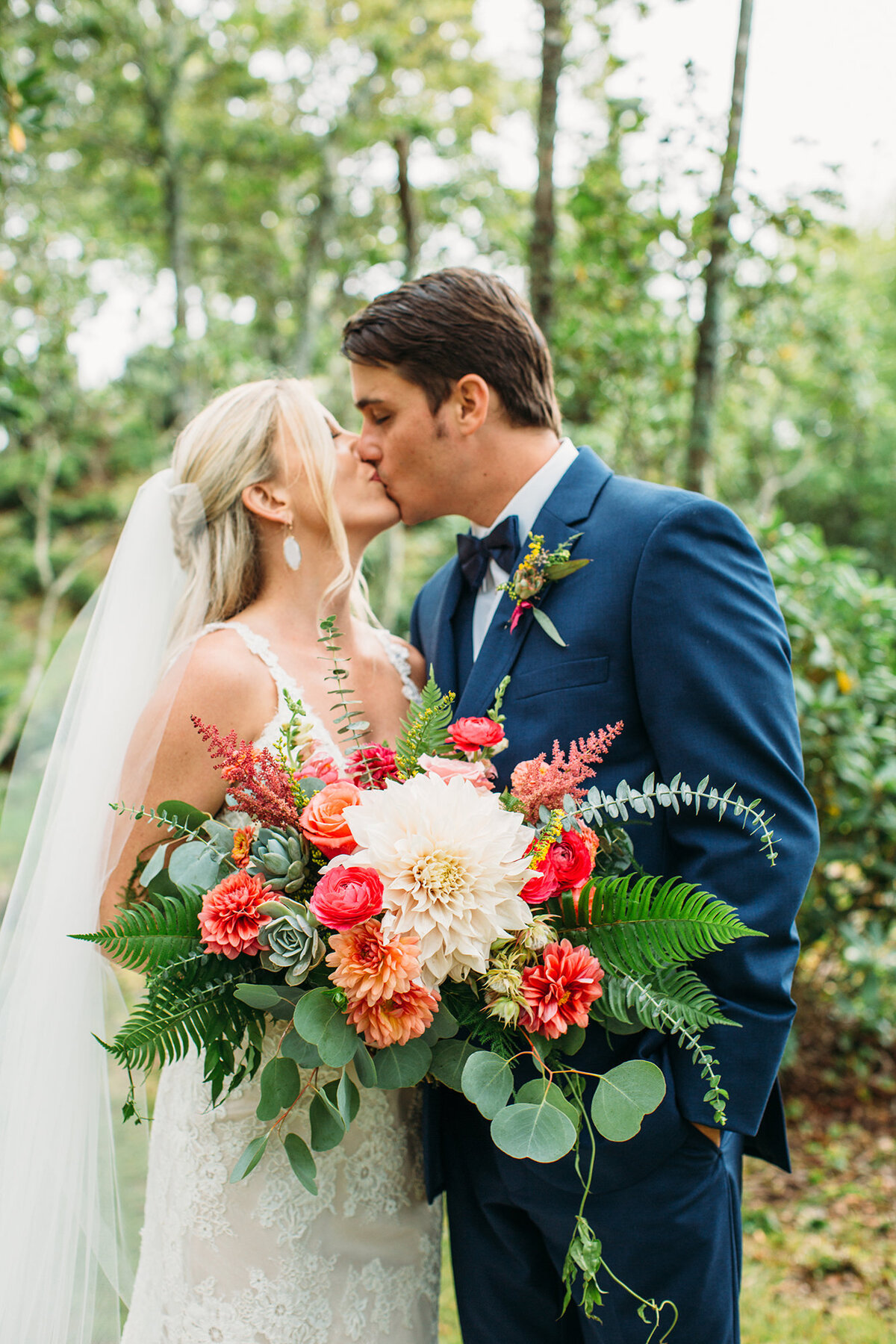 Wedding photo in West Jefferson, NC of a bride and groom kissing on their wedding day.