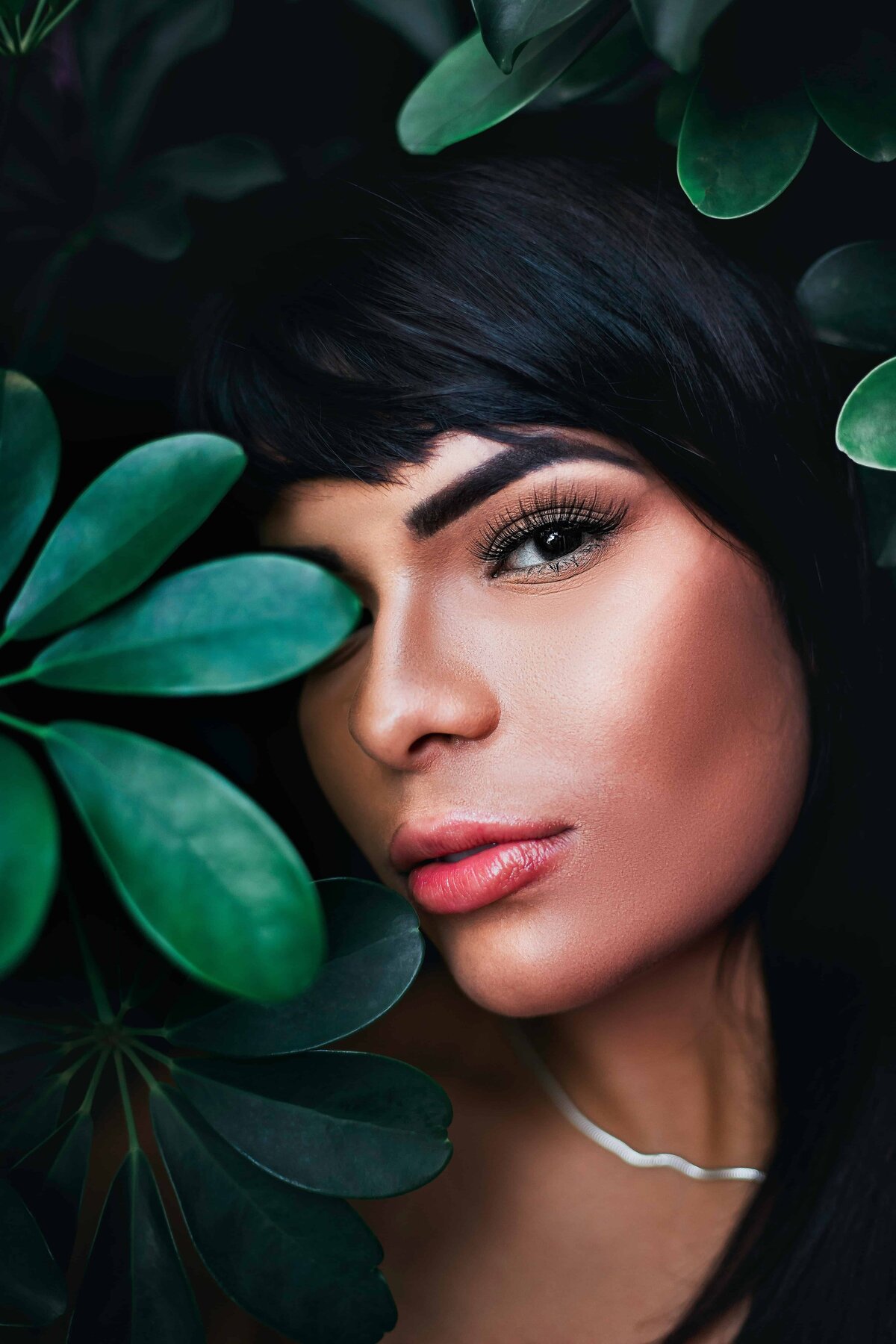 woman-hiding-behind-plant