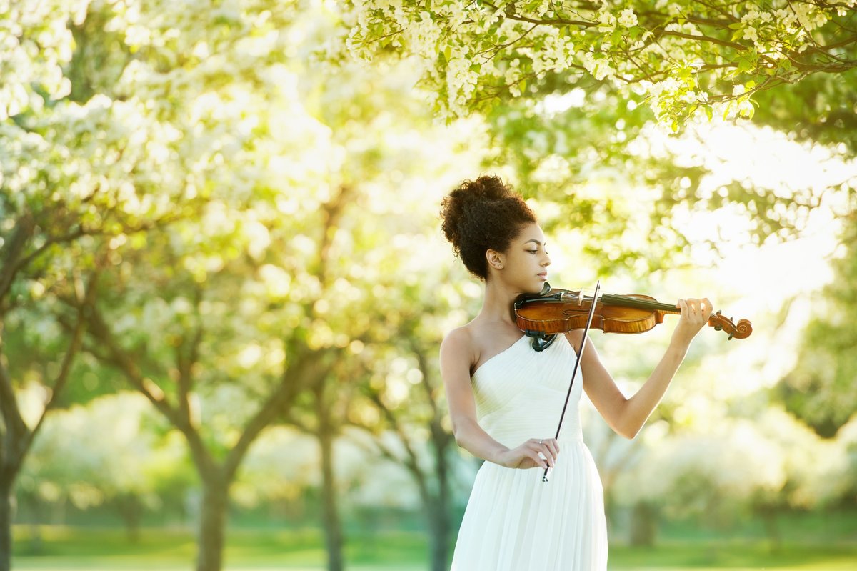 girl in white dress surrounded by blooming trees in Chanhassen MN