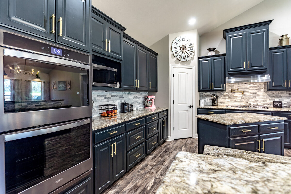 Fully stocked kitchen in this five-bedroom, 3-bathroom vacation rental house for up to 10 guests with free wifi, private parking, outdoor games and seating, and bbq grill on 2 acres of land near Waco, TX.