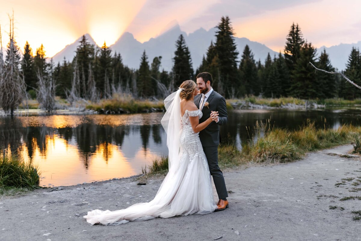 A couple's first dance at Schwabacher Landing in Grand Teton National Park