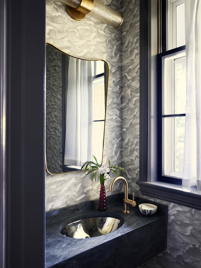 Powder room design with wallpaper at a historic home interior design project by an interior decorator in Boston, blending classic charm with modern style.