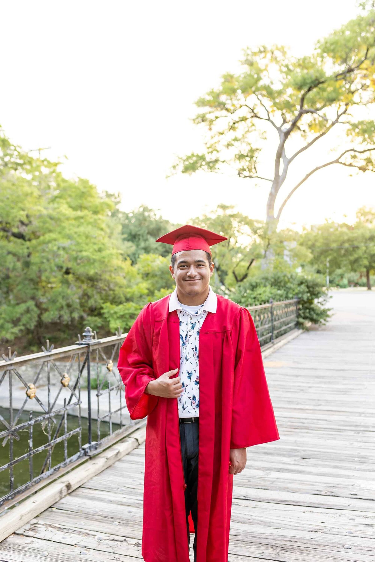 Senior in red cap and gown