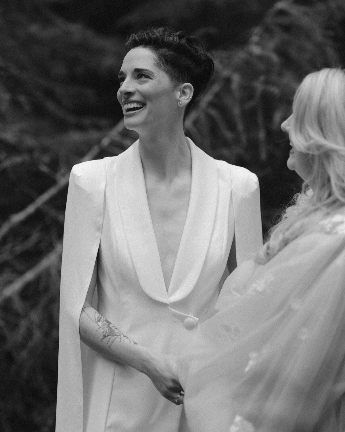 Marrier in a white suit with cape for an Oregon micro wedding